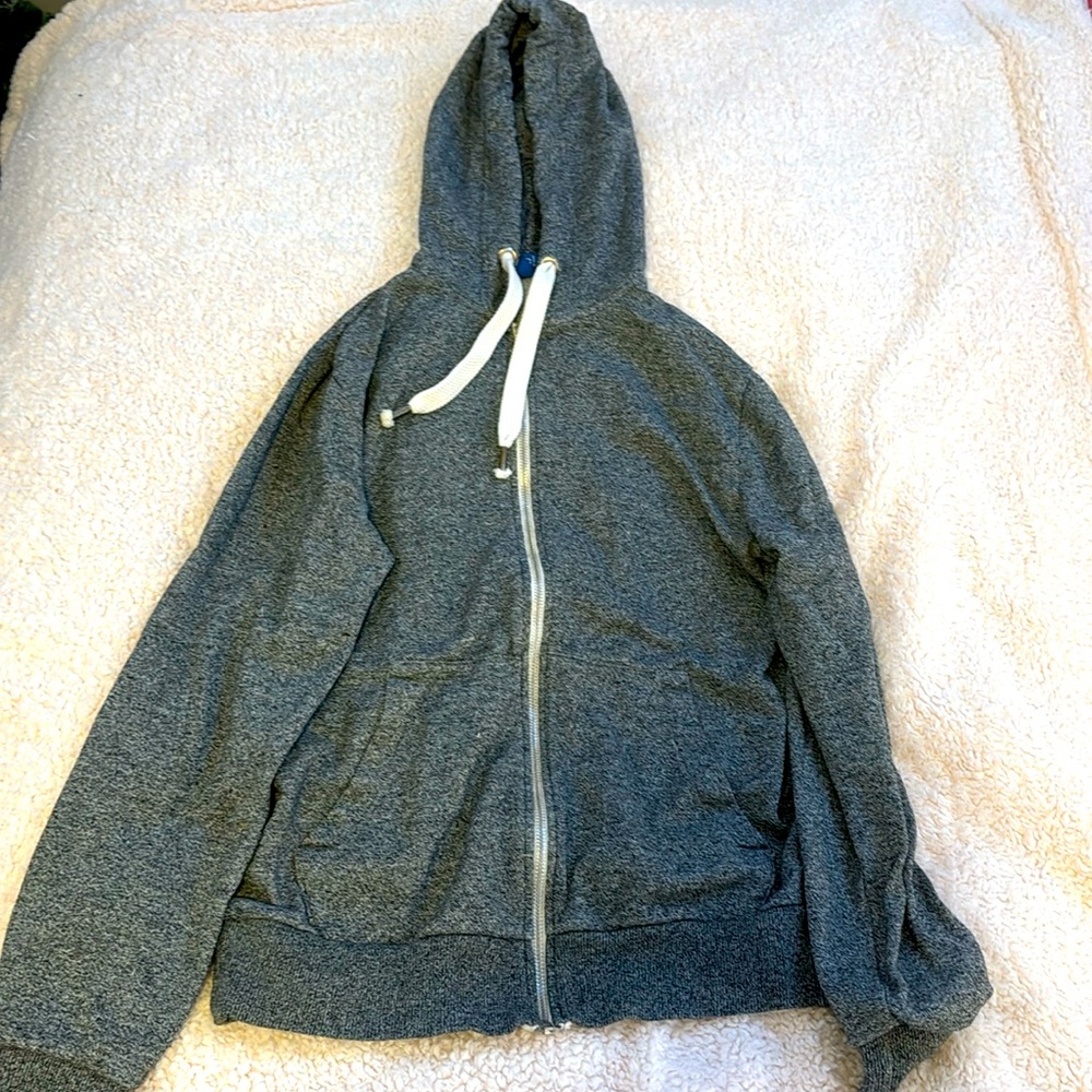 grey zip up.
